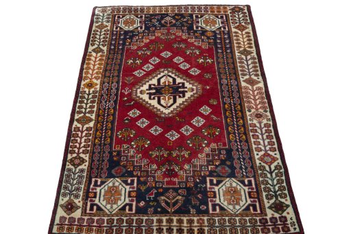 Surface texture of 2000s Shiraz rug with natural Wool and intricate pattern