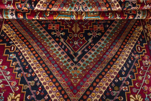 Corner detail of 2000s Shiraz rug showing border pattern and Wool pile