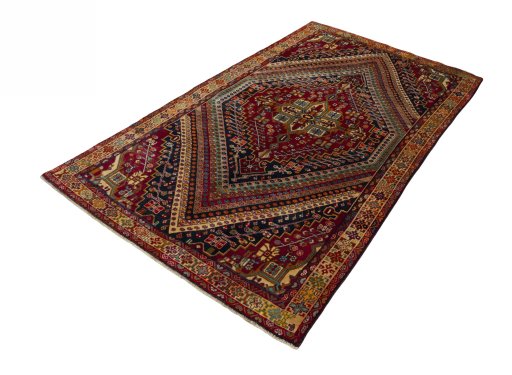 Corner detail of 2000s Shiraz rug showing border pattern and Wool pile