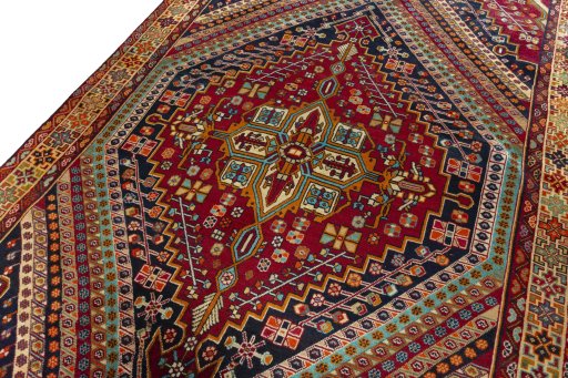 Backside of handmade 2000s Shiraz rug showing knot structure and weave density