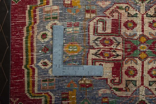 Backside of handmade 2000s Shiraz rug showing knot structure and weave density