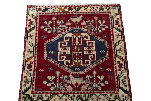 Surface texture of 2000s Shiraz rug with natural Wool and intricate pattern