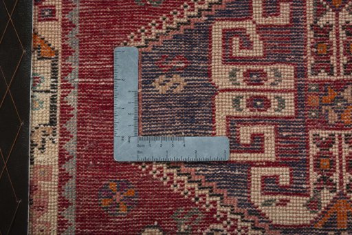 Backside of handmade 2000s Shiraz rug showing knot structure and weave density