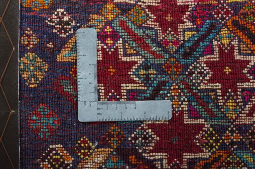 Backside of handmade 2000s Shiraz rug showing knot structure and weave density