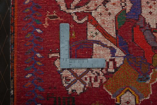 Backside of handmade 2000s Shiraz rug showing knot structure and weave density