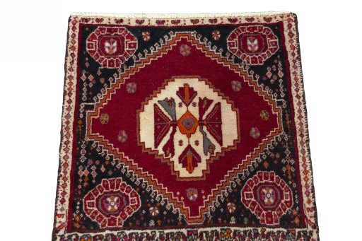Surface texture of 2000s Shiraz rug with natural Wool and intricate pattern