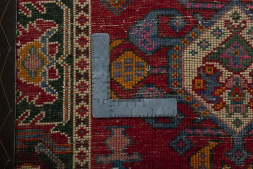 Backside of handmade 2000s Shiraz rug showing knot structure and weave density