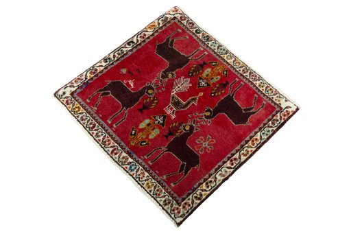 Corner detail of 2000s Shiraz rug showing border pattern and Wool pile