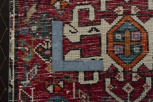 Backside of handmade 2000s Shiraz rug showing knot structure and weave density