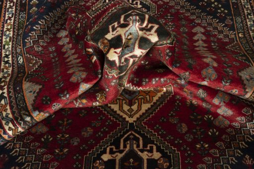 Corner detail of 2000s Shiraz rug showing border pattern and Wool pile