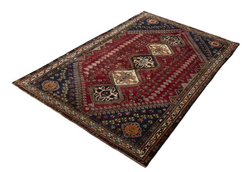 Corner detail of 2000s Shiraz rug showing border pattern and Wool pile