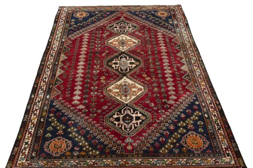 Surface texture of 2000s Shiraz rug with natural Wool and intricate pattern