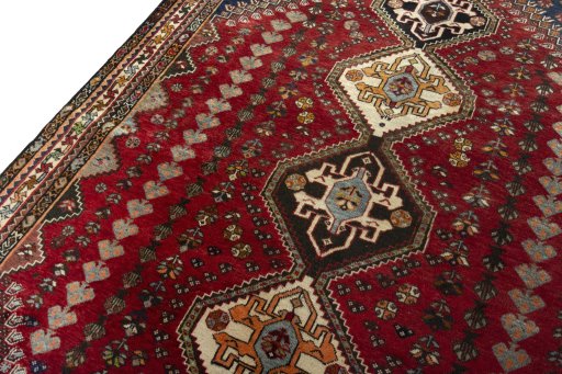 Backside of handmade 2000s Shiraz rug showing knot structure and weave density