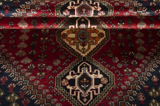 Full view of 2000s Shiraz rug from Iran / Persia, 271 × 173 cm in Red tones