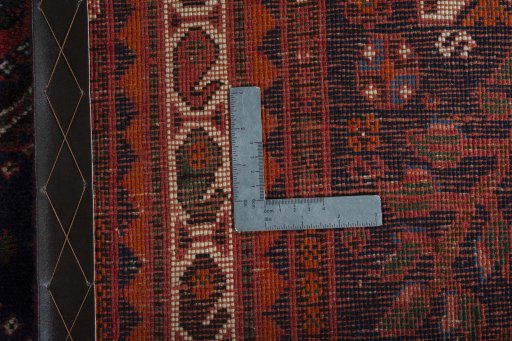 Surface texture of 2000s Shiraz rug with natural Wool and intricate pattern