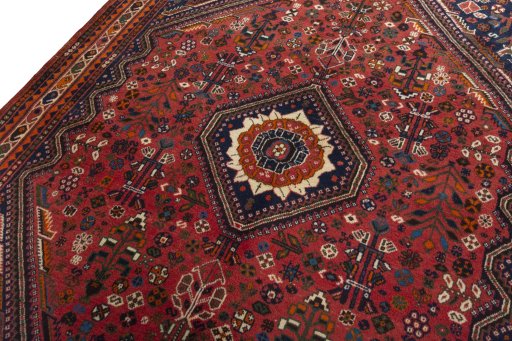 Backside of handmade 2000s Shiraz rug showing knot structure and weave density