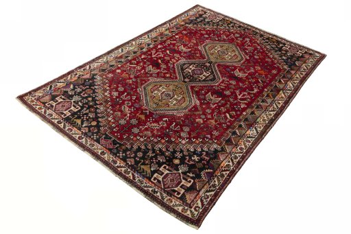 Corner detail of 2000s Shiraz rug showing border pattern and Cotton pile