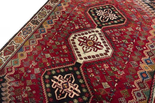Backside of handmade 2000s Shiraz rug showing knot structure and weave density