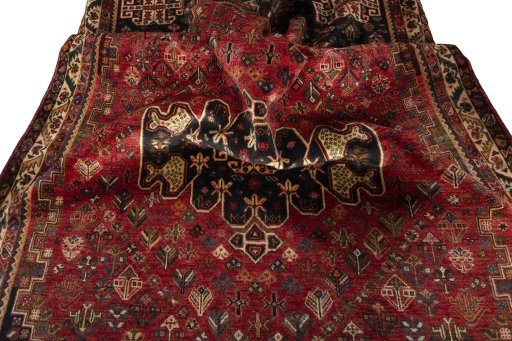 Surface texture of 2000s Shiraz rug with natural Wool and intricate pattern