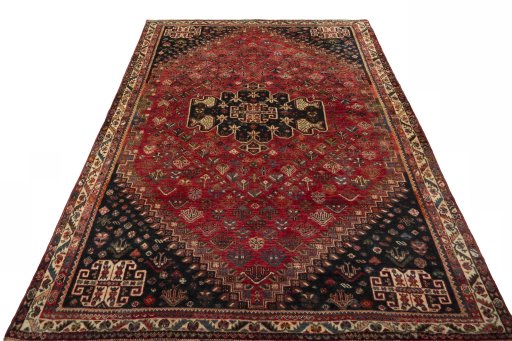 Surface texture of 2000s Shiraz rug with natural Wool and intricate pattern