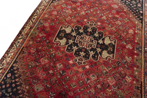 Backside of handmade 2000s Shiraz rug showing knot structure and weave density