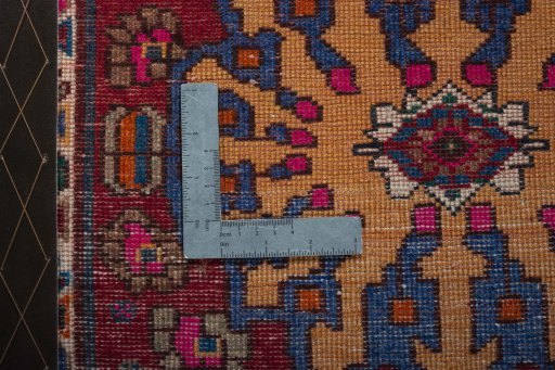 Backside of handmade 2000s Shiraz rug showing knot structure and weave density