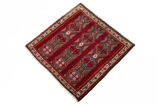 Corner detail of 2000s Shiraz rug showing border pattern and Wool pile