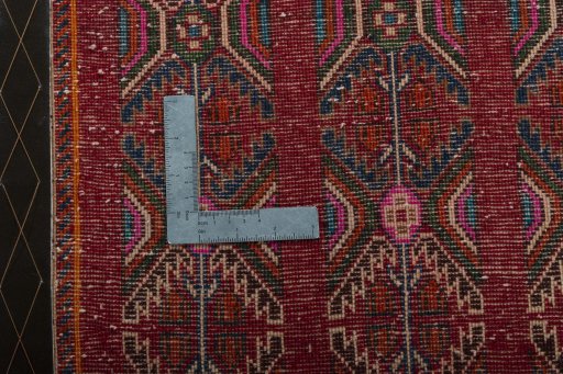 Backside of handmade 2000s Shiraz rug showing knot structure and weave density