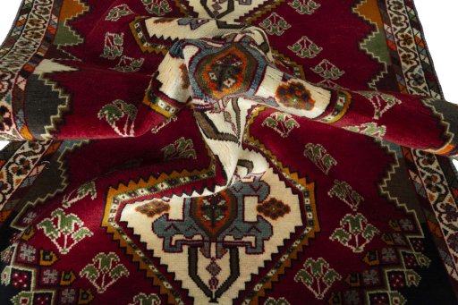 Corner detail of 2000s Shiraz rug showing border pattern and Wool pile