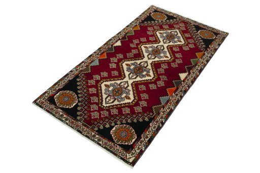 Corner detail of 2000s Shiraz rug showing border pattern and Wool pile