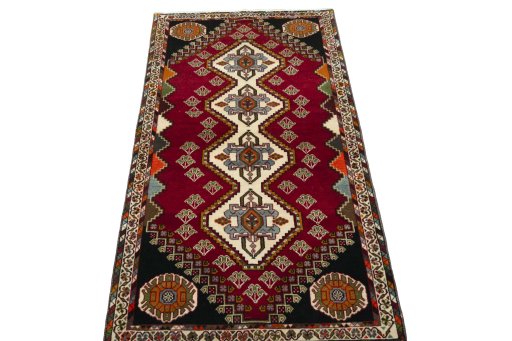 Surface texture of 2000s Shiraz rug with natural Wool and intricate pattern