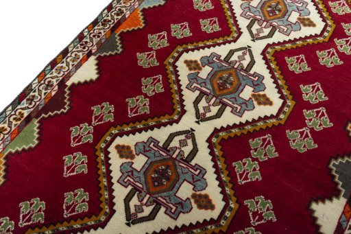 Backside of handmade 2000s Shiraz rug showing knot structure and weave density