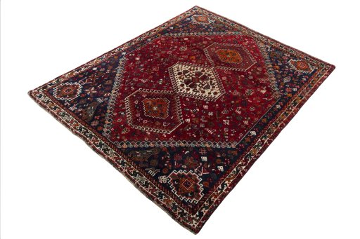Corner detail of 2000s Shiraz rug showing border pattern and Wool pile
