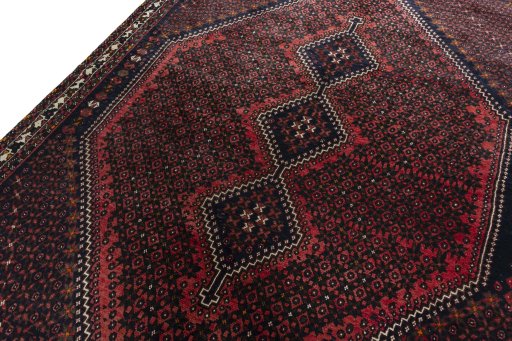 Backside of handmade 2000s Shiraz rug showing knot structure and weave density