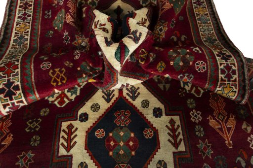 Corner detail of 2000s Shiraz rug showing border pattern and Wool pile