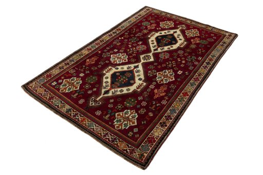 Corner detail of 2000s Shiraz rug showing border pattern and Wool pile