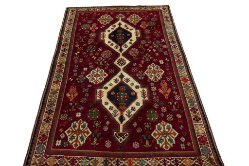 Surface texture of 2000s Shiraz rug with natural Wool and intricate pattern