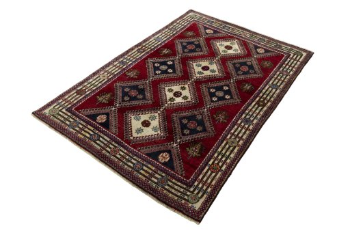Corner detail of 2000s Shiraz rug showing border pattern and Wool pile