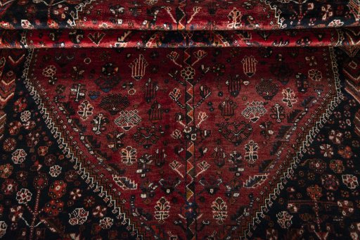 Corner detail of 1970s Shiraz rug showing border pattern and Wool pile