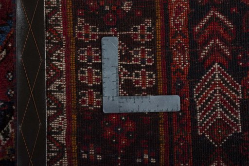 Surface texture of 1970s Shiraz rug with natural Wool and intricate pattern