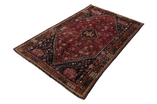 Corner detail of 1970s Shiraz rug showing border pattern and Wool pile