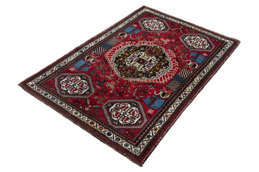 Corner detail of 2000s Shiraz rug showing border pattern and Wool pile