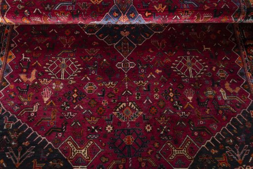 Corner detail of 2000s Shiraz rug showing border pattern and Wool pile
