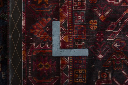 Surface texture of 2000s Shiraz rug with natural Wool and intricate pattern