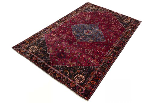 Corner detail of 2000s Shiraz rug showing border pattern and Wool pile