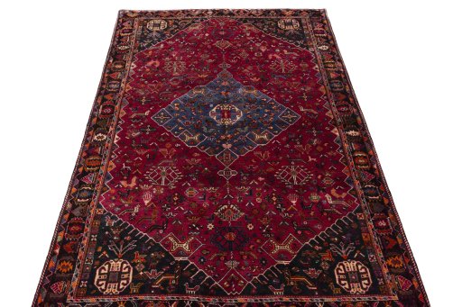 Surface texture of 2000s Shiraz rug with natural Wool and intricate pattern