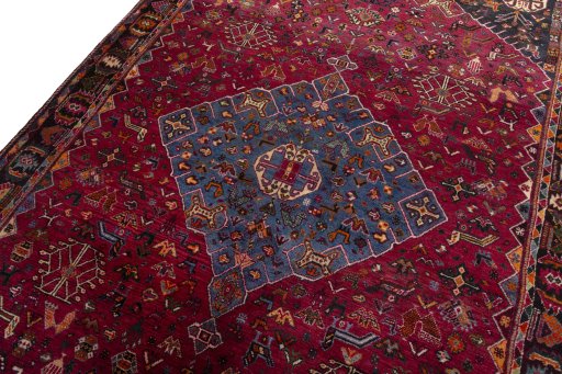 Backside of handmade 2000s Shiraz rug showing knot structure and weave density