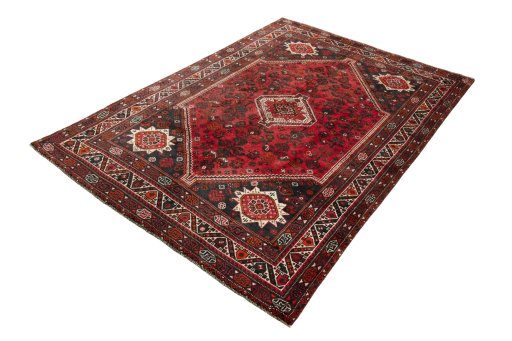 Corner detail of 2000s Shiraz rug showing border pattern and Wool pile