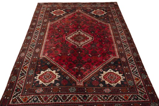 Surface texture of 2000s Shiraz rug with natural Wool and intricate pattern