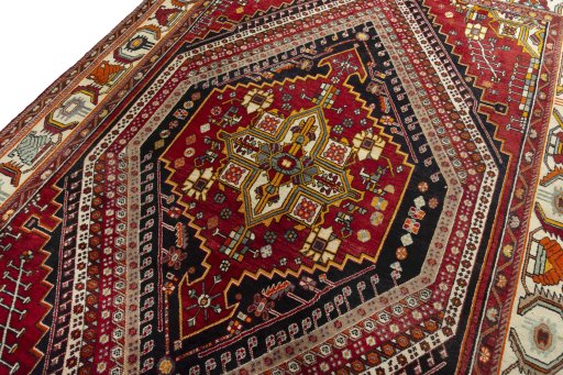 Backside of handmade 2000s Shiraz rug showing knot structure and weave density